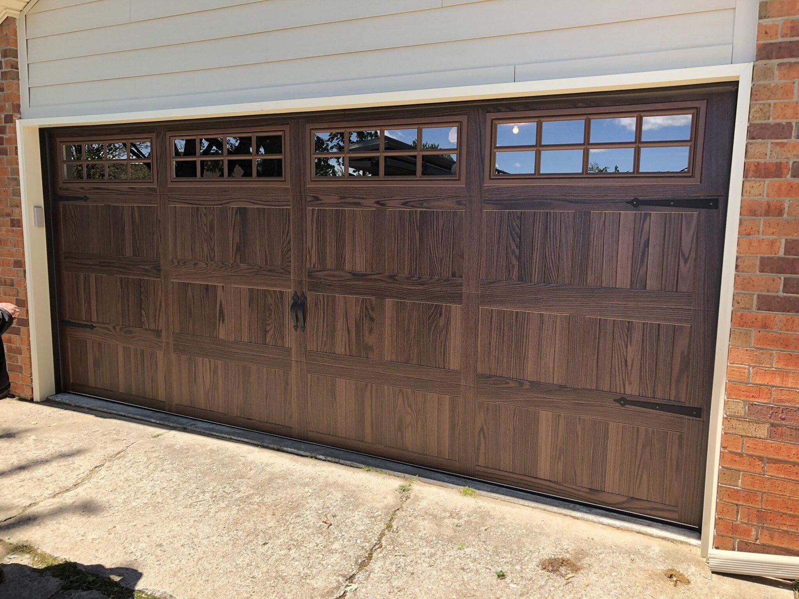 Wood-look garage door with upper windows